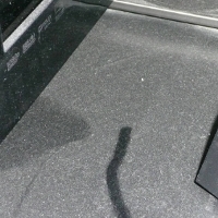 The eternally dusty TV stand in room light