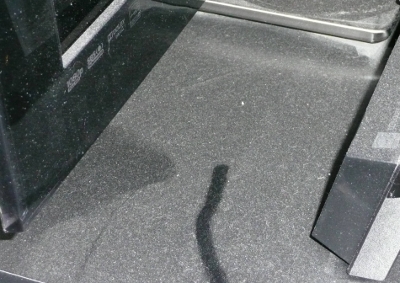 The eternally dusty TV stand in room light